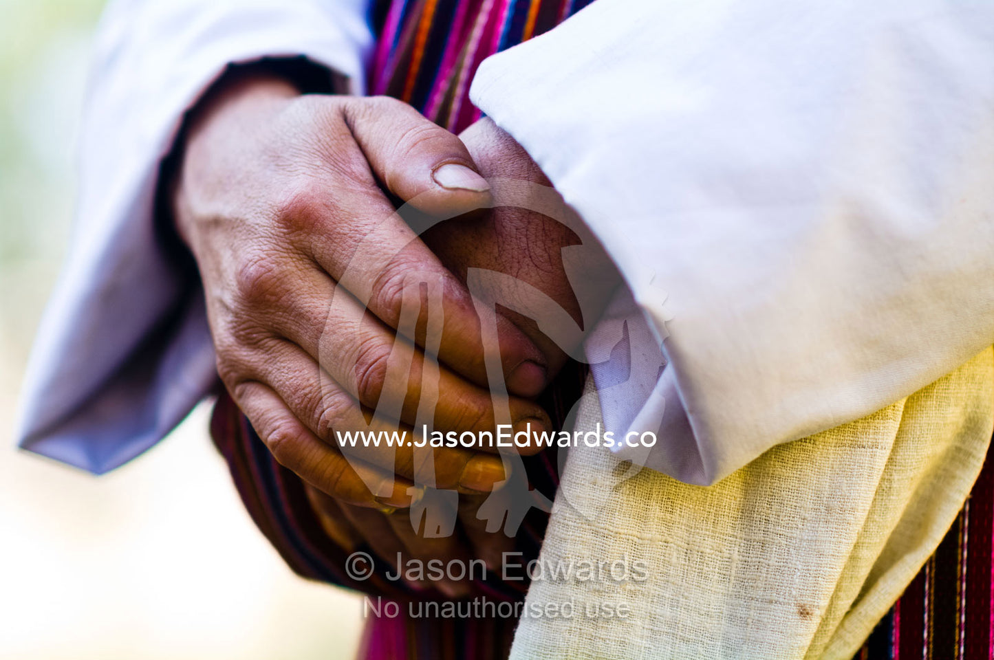 The hands of a Buddhist visiting a monastery. Rinpung Dzong, Paro Dzong, Paro, Paro District, Bhutan.