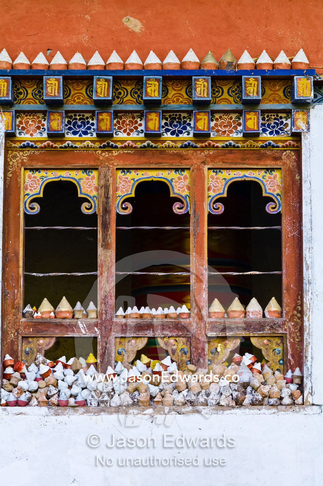 The window of a Mani Chukhor built over a small stream that turns the prayer wheel inside. Thimphu District, Bhutan.