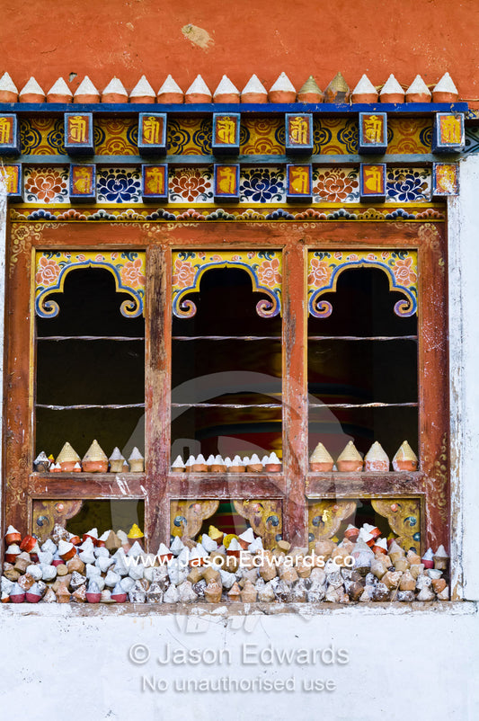 The window of a Mani Chukhor built over a small stream that turns the prayer wheel inside. Thimphu District, Bhutan.