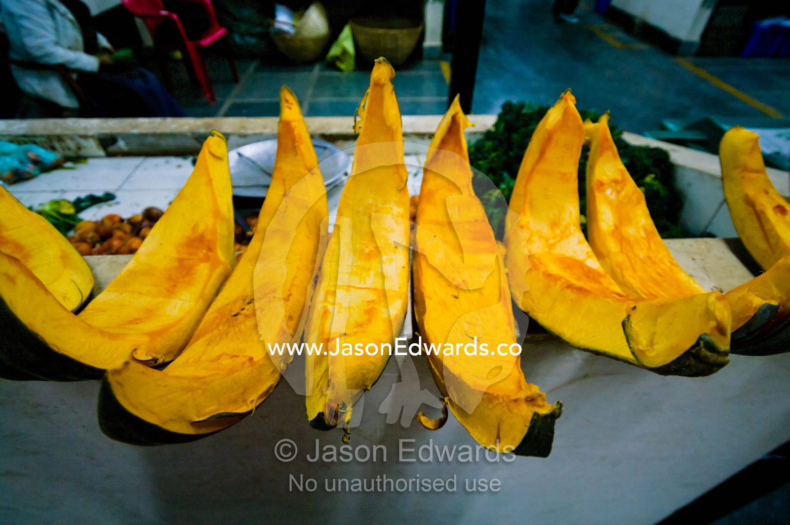 Fresh, healthy and organic pumpkin wedges for sale in a Himalayan farmers market. Thimphu, Thimphu District, Bhutan.