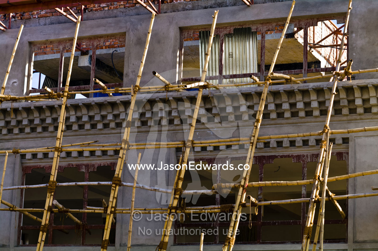 Bamboo poles used to construct a new building in Thimhu's business district. Thimphu, Thimphu District, Bhutan.