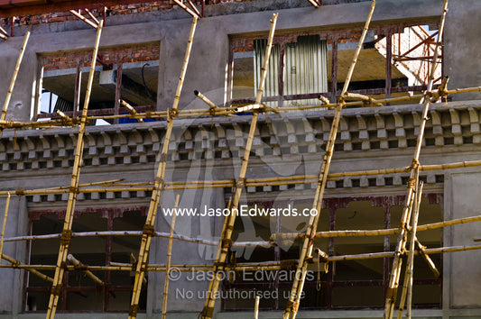 Bamboo poles used to construct a new building in Thimhu's business district. Thimphu, Thimphu District, Bhutan.
