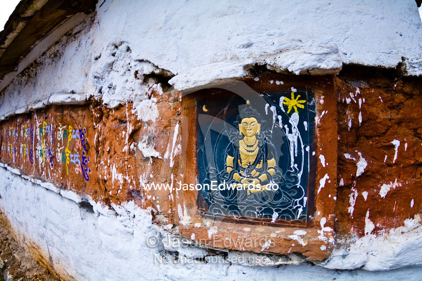 A traditional slate carving of Buddha Amitabha on a Buddhist temple. 108 Druk Wangyal Khangzang Chortens, Dochula Pass, Thimphu District, Bhutan.