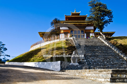 Stone steps lead to a war memorial on a Himalayan mountain pass. 108 Druk Wangyal Khangzang Chortens, Dochula Pass, Thimphu District, Bhutan.