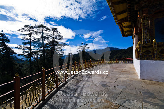 An ornamental fence surrounds a paved courtyard in a war memorial. 108 Druk Wangyal Khangzang Chortens, Dochula Pass, Thimphu District, Bhutan.