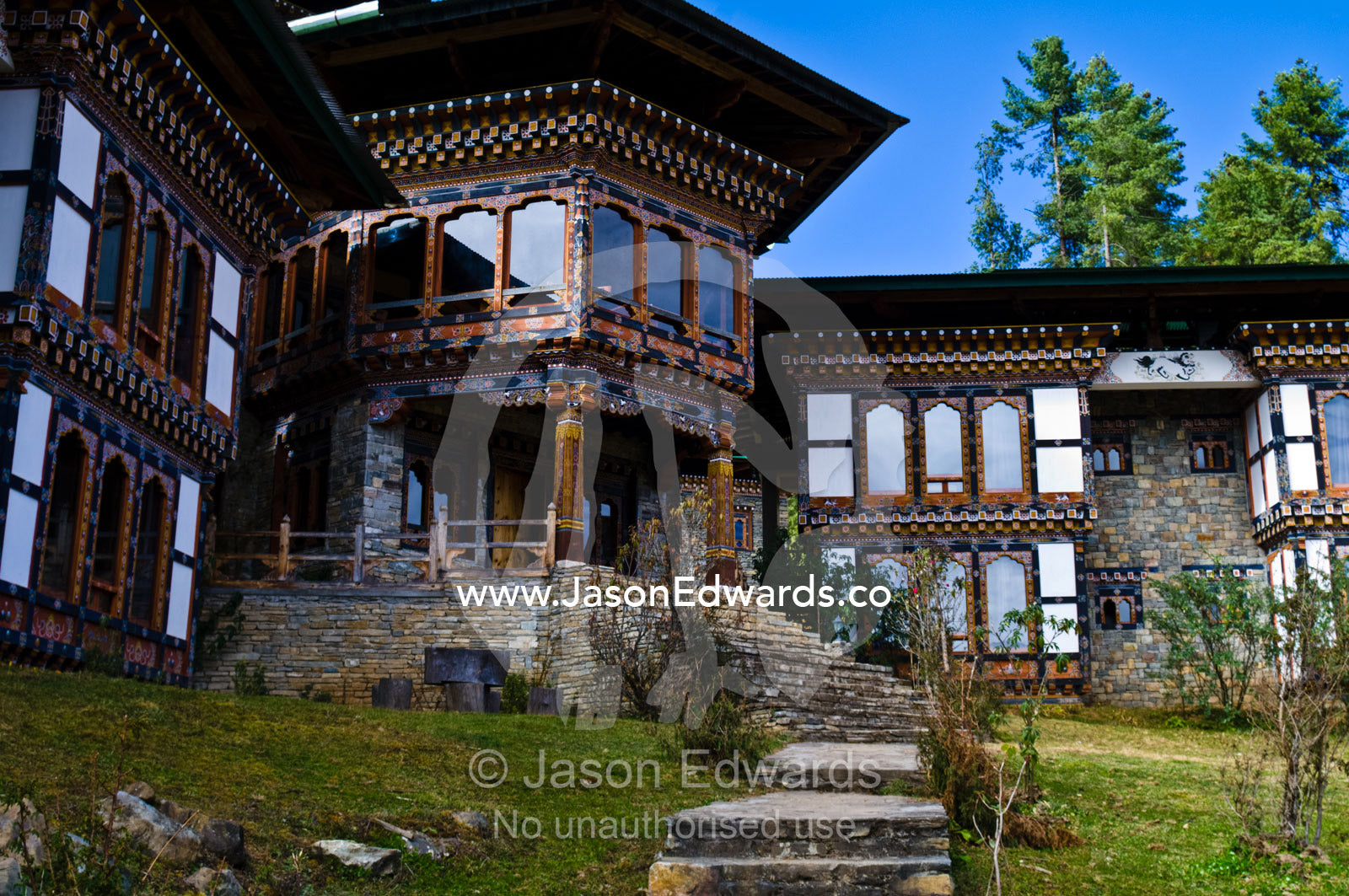 A Bhutanese hotel caters to bird watchers intent on seeing the wetland home of the Vulnerable Black-necked Crane. Phobjikha Conservation Area, Phobjika Valley, Phobjikha Valley, Gangteng Valley, Black Mountains, Bhutan.
