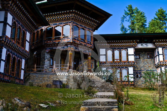 A Bhutanese hotel caters to bird watchers intent on seeing the wetland home of the Vulnerable Black-necked Crane. Phobjikha Conservation Area, Phobjika Valley, Phobjikha Valley, Gangteng Valley, Black Mountains, Bhutan.