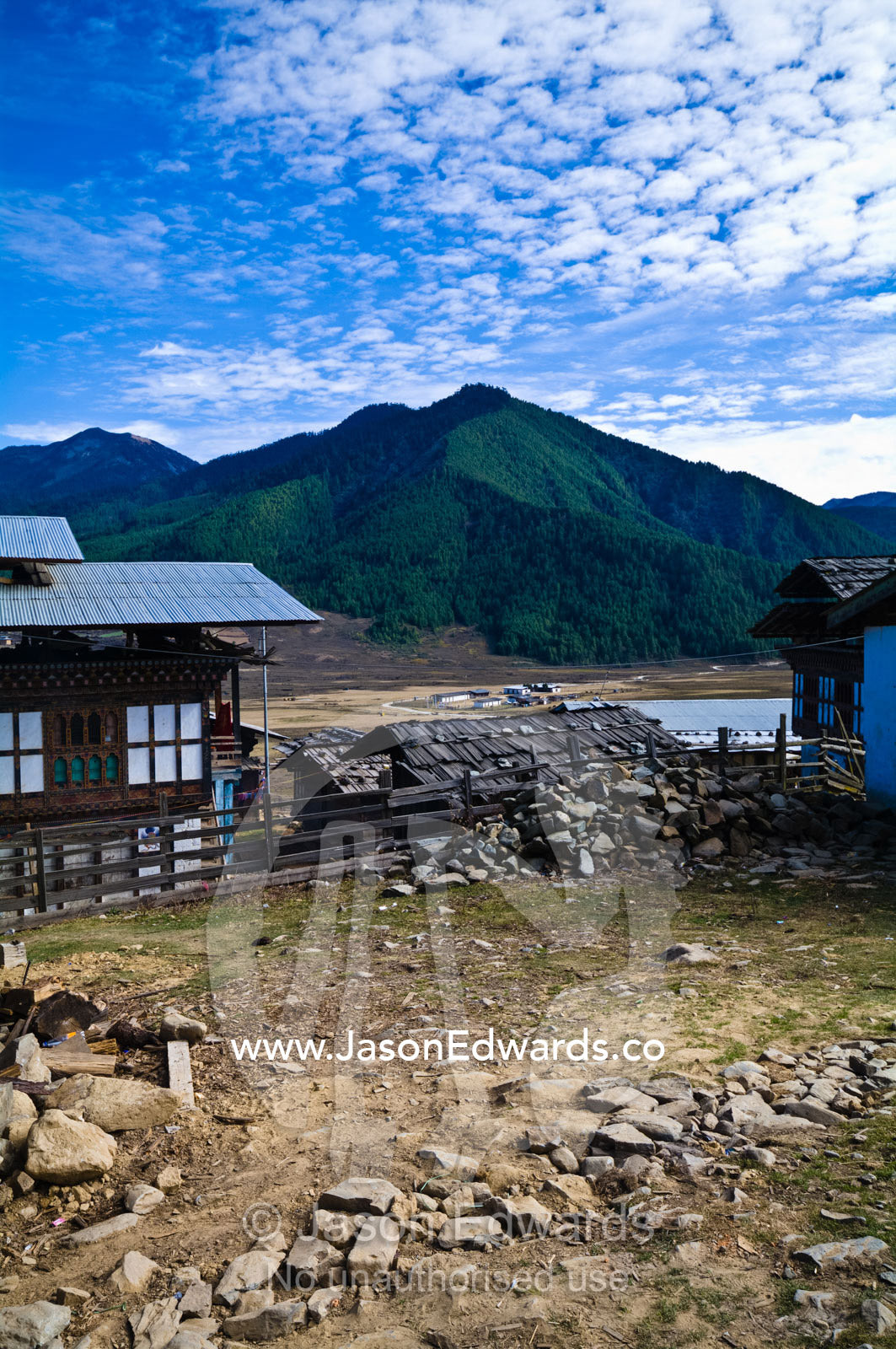 Construction of the rock foundations of a Bhutanese farmhouse overlooking a high altitude wetland. Phobjikha Conservation Area, Phobjika Valley, Phobjikha Valley, Gangteng Valley, Black Mountains, Bhutan.