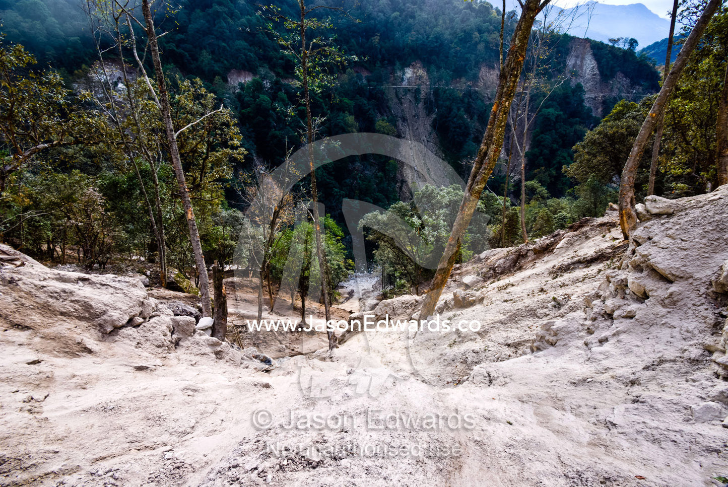 Road construction causes a landslide of soil and rocks destroys on a Himalayan mountainside. Punakha District, Bhutan.