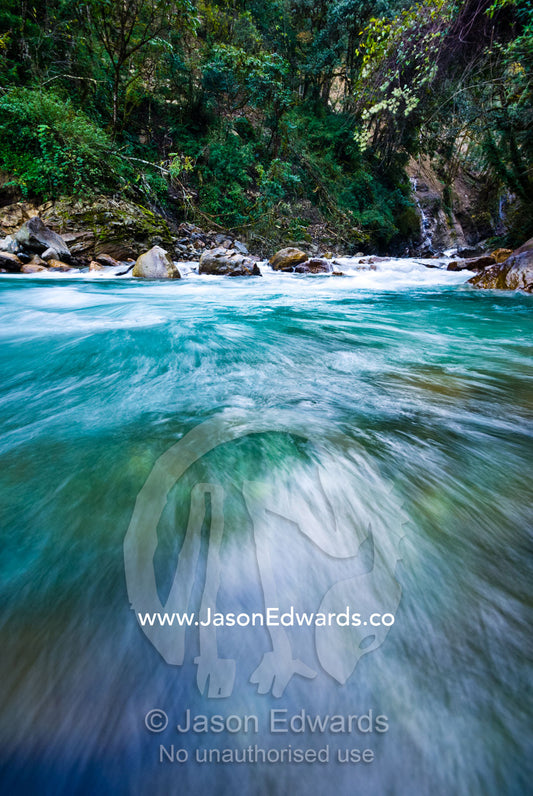 Icy water from snowmelt rushes through a mountain gorge in the Himalaya. Pho Chu, Pho River, Gasa Dzong, Gasa Tashi Tongmon Dzong, Gasa Gasa Dzongkhag District, Bhutan.