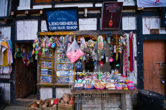 A roadside general store selling mixed goods in a Himalaya village at an intersection of highways. Wangdi, Wangdue Phodrang, Wangdue Phodrang District, Bhutan.