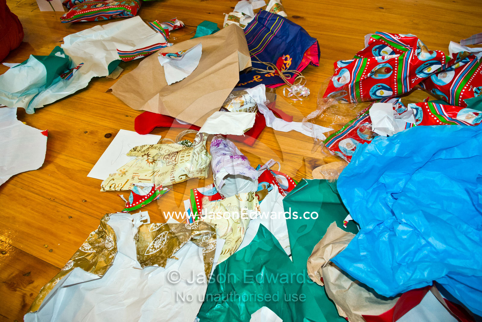Wrapping paper litters the floor after Christmas presents are opened. Carlton North, Melbourne, Victoria, Australia.