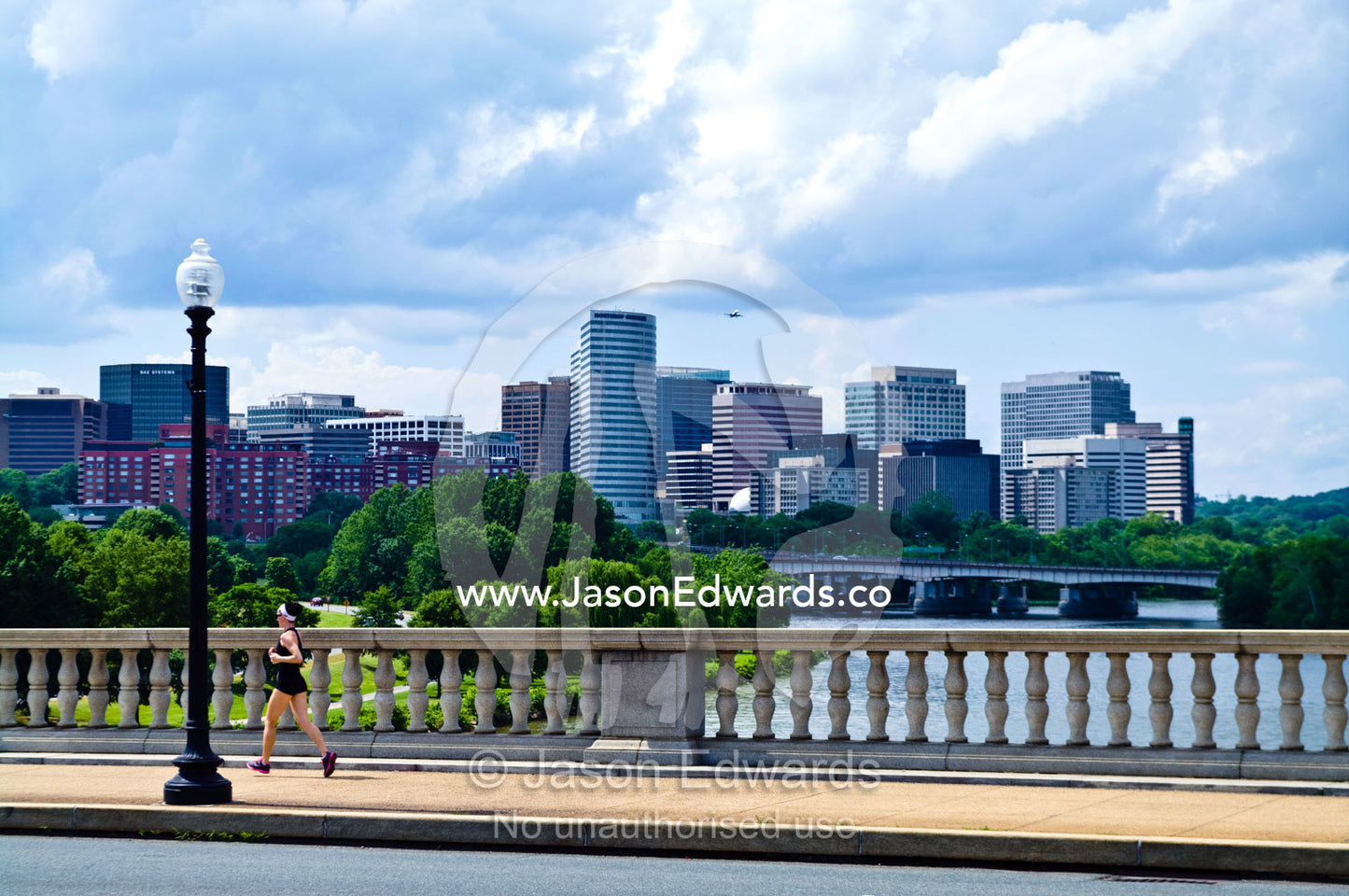 A runner crosses the Arlington Memorial Bridge over the Potomac River. Washington, District of Columbia, United States of America.