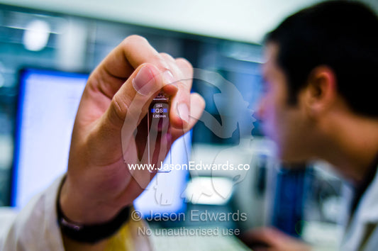 A scientist setting up a cuvette for circular dichroism spectroscopy. Bio21 Molecular Science and Biotechnology Institute, University of Melbourne, Parkville, Melbourne, Victoria, Australia.
