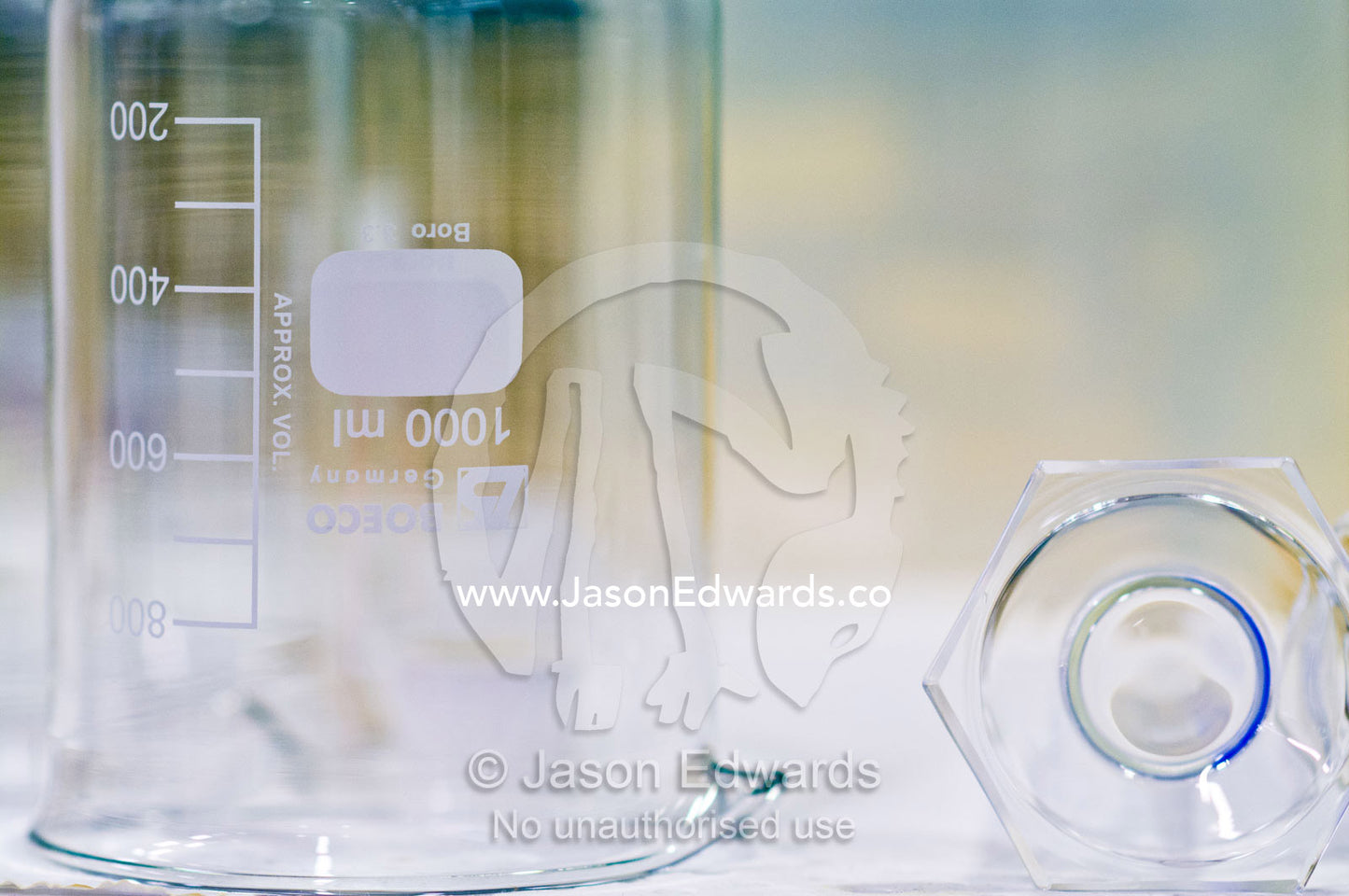 A glass beaker and volumetric cylinder used to measure liquid volumes. Bio21 Molecular Science and Biotechnology Institute, University of Melbourne, Parkville, Melbourne, Victoria, Australia.