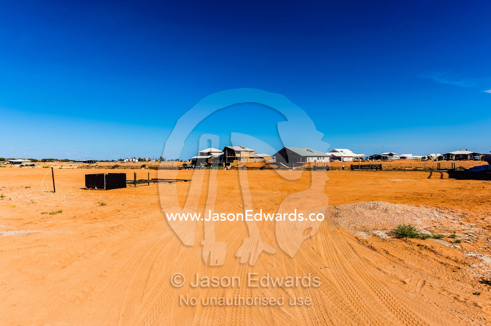 A vacant block of land in a new suburb awaits house construction. Exmouth, Ningaloo Reef, Western Australia, Australia.