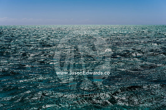 Dappled sunlight reflecting off the surface of a tropical ocean. Exmouth, Ningaloo Reef, Ningaloo Marine Park, World Heritage Site, Western Australia, Australia.