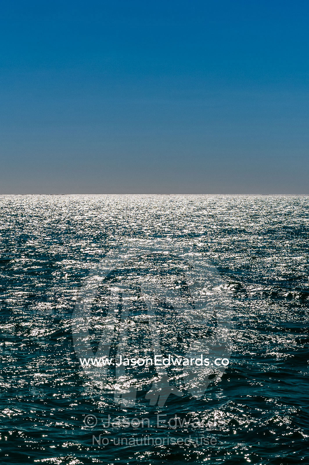 Sunshine reflecting off the ocean surface all the way to the horizon. Exmouth, Ningaloo Reef, Ningaloo Marine Park, World Heritage Site, Western Australia, Australia.