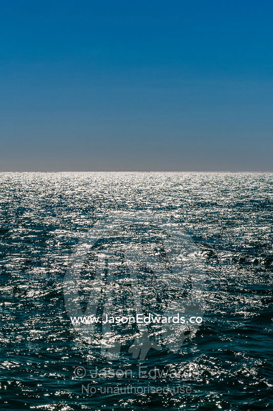 Sunshine reflecting off the ocean surface all the way to the horizon. Exmouth, Ningaloo Reef, Ningaloo Marine Park, World Heritage Site, Western Australia, Australia.