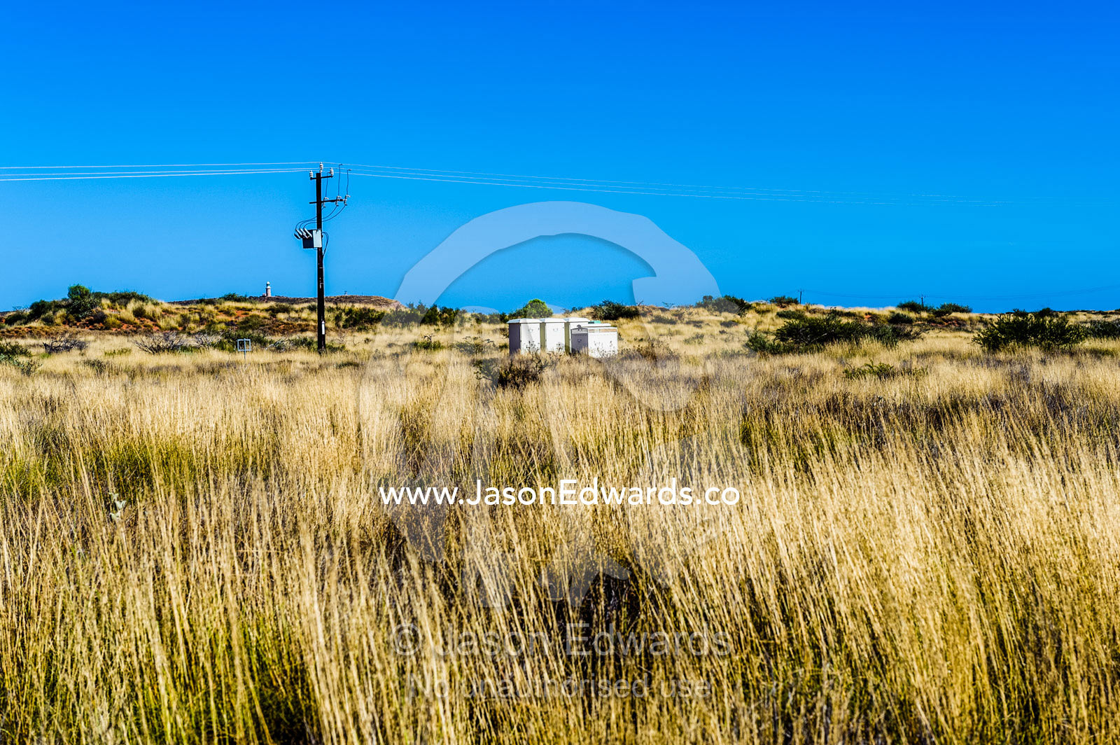 An abandoned shed in a field of Spinifex Grass in the desert. Cape Range National Park, Exmouth, Ningaloo Reef, Western Australia, Australia.
