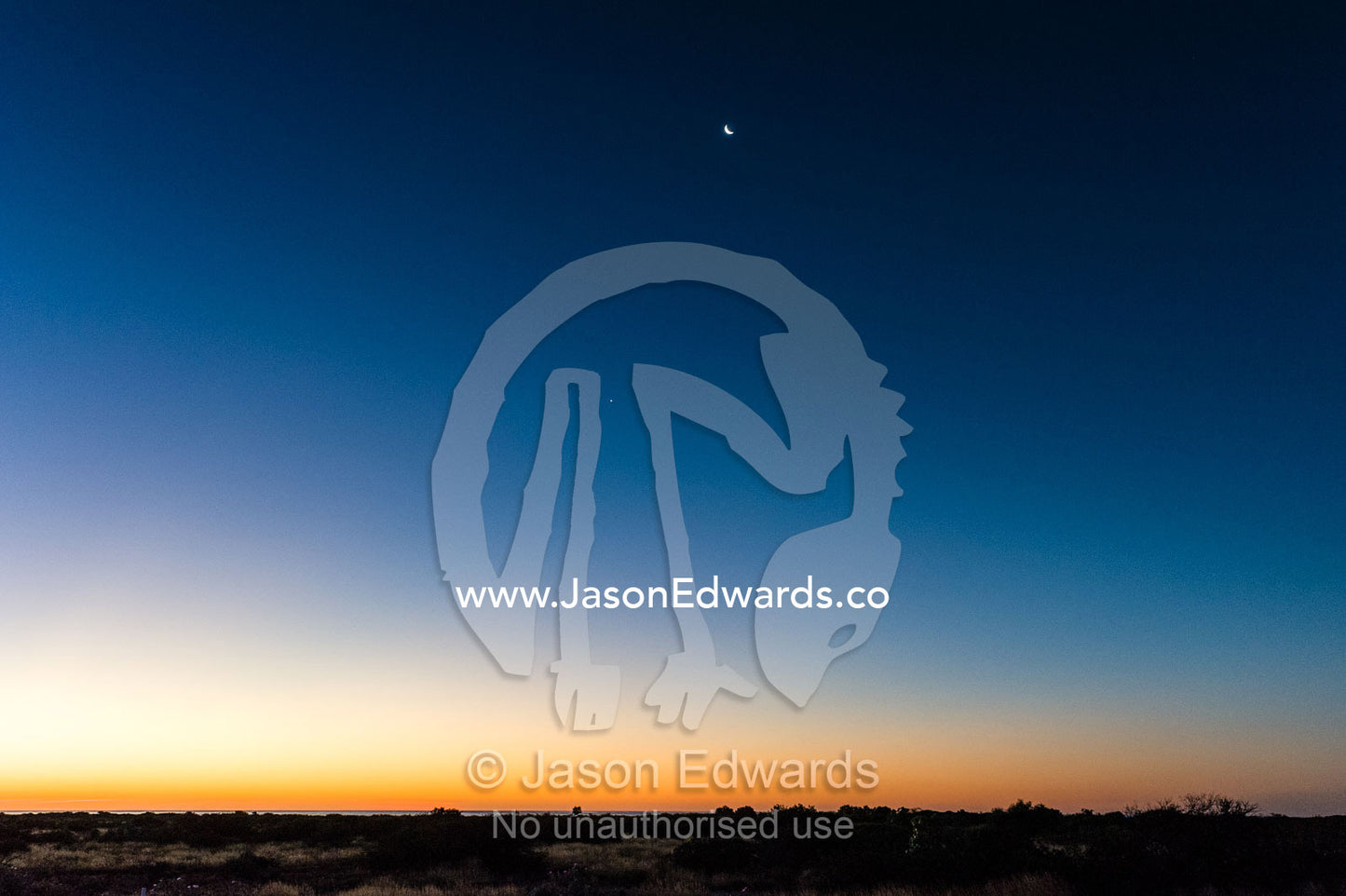 A tranquil moonrise over a coastal desert by warm tropical seas. Cape Range National Park, Exmouth, Ningaloo Reef, Western Australia, Australia.