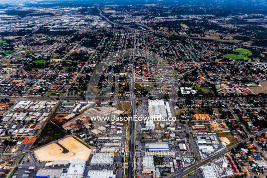 A factory and industrial precinct next to suburban housing sprawl. Perth, Western Australia, Australia.