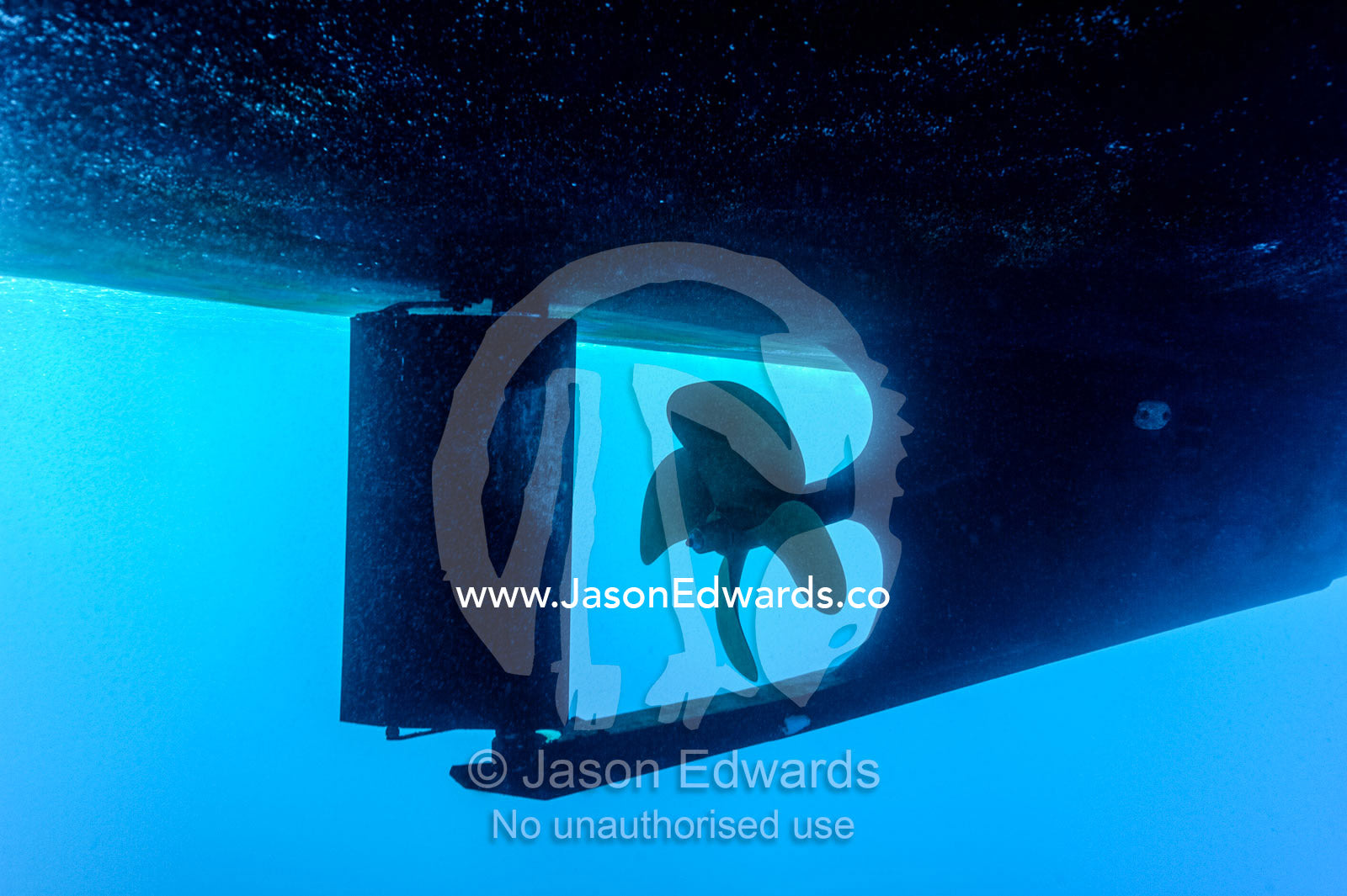 An underwater view of a boat propeller and rudder. Exmouth, Ningaloo Reef, Ningaloo Marine Park, Western Australia, Australia.