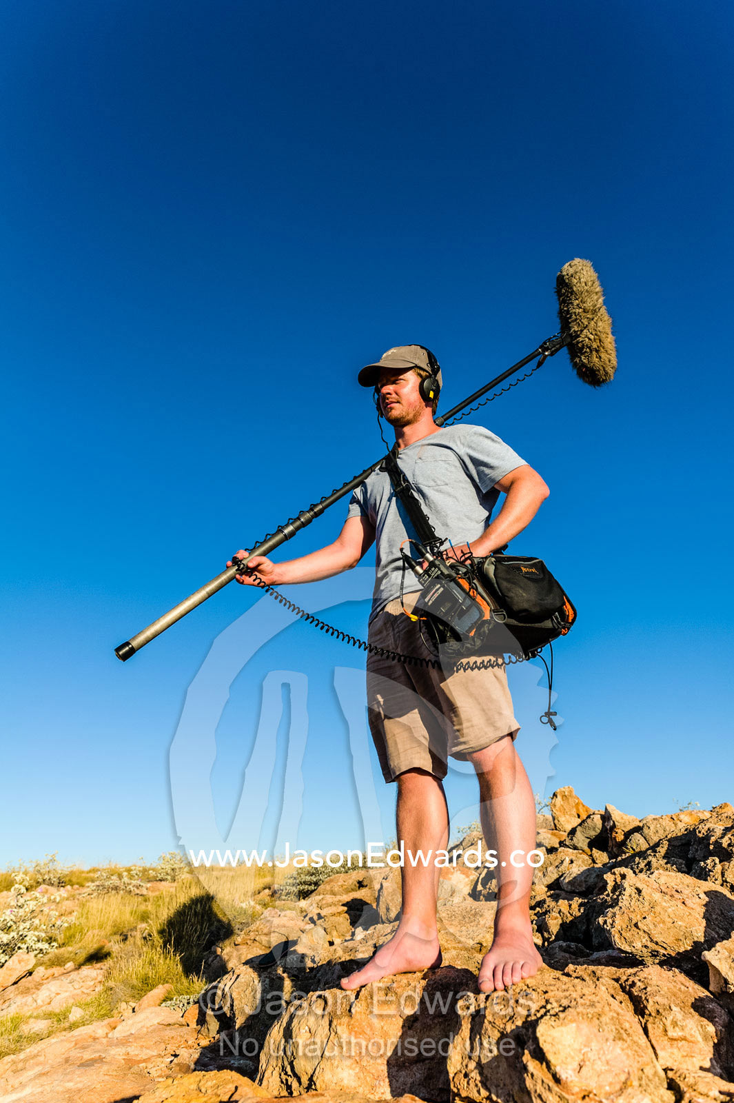 A sound engineer with his microphone and recording equipment. Cape Range National Park, Exmouth, Ningaloo Reef, Western Australia, Australia.