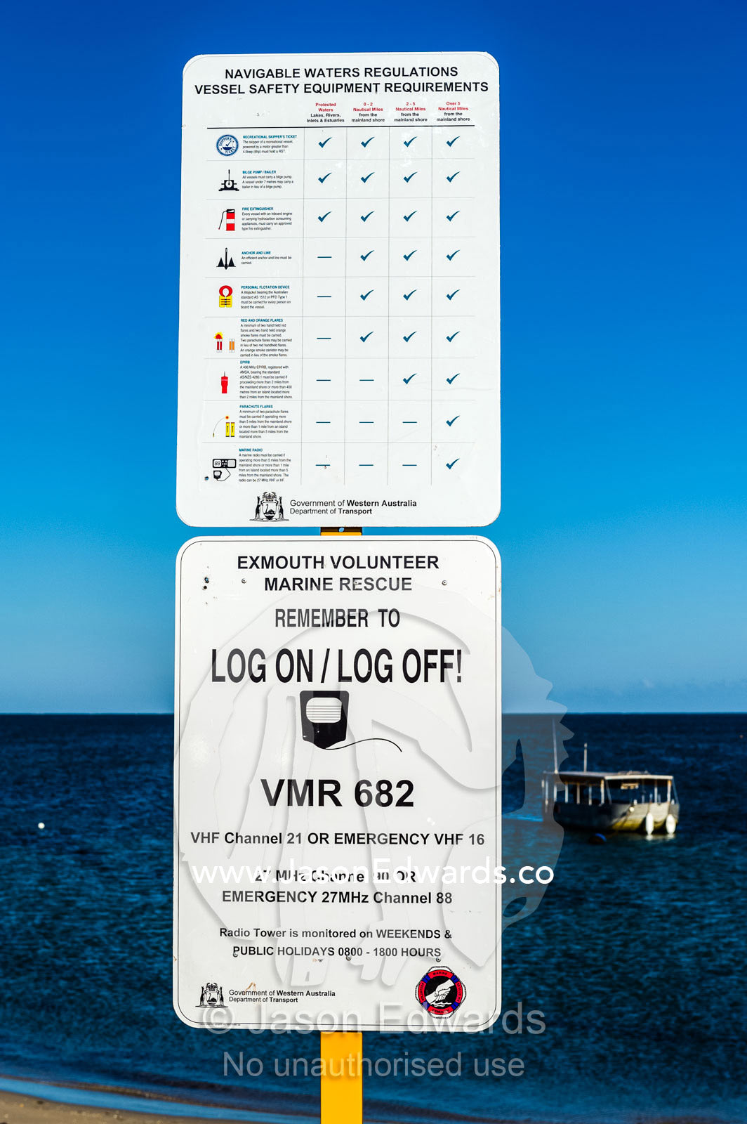 A boat safety equipment sign with emergency radio frequency data. Exmouth, Ningaloo Reef, Western Australia, Australia.