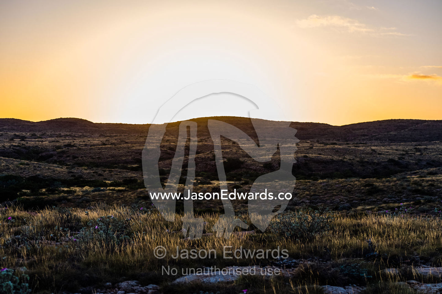 Dawn rising over an arid rocky coastal desert in Big Sky Country. Cape Range National Park, Exmouth, Ningaloo Reef, Western Australia, Australia.
