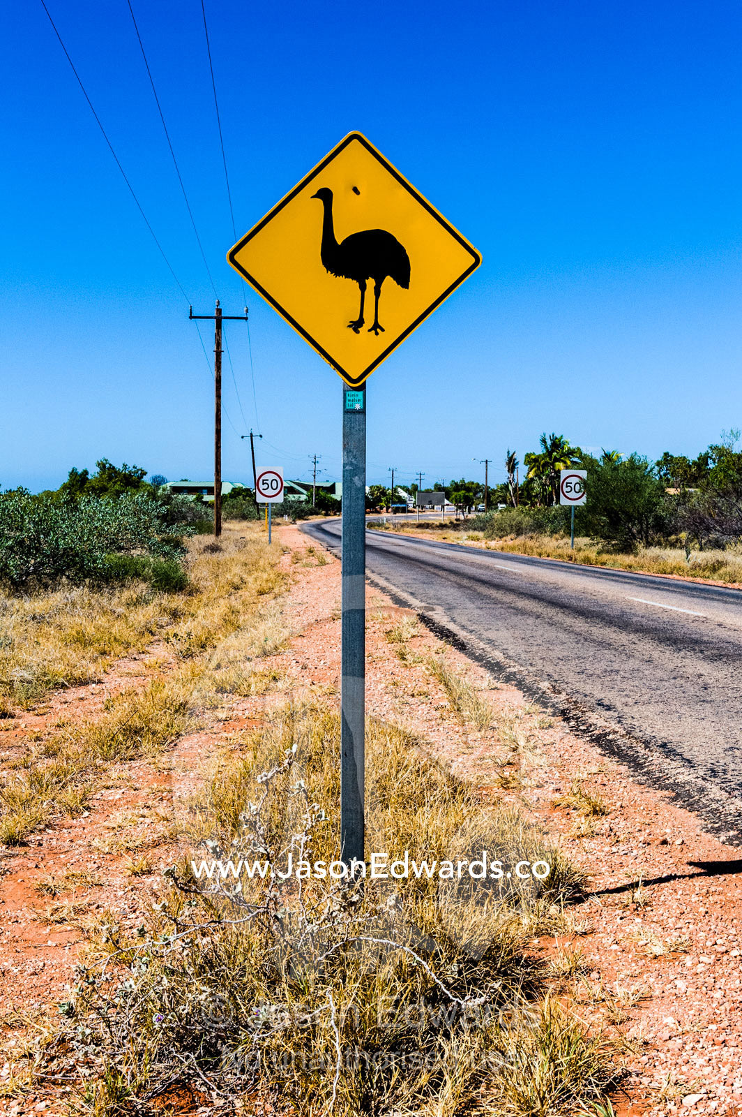 An Emu wildlife warning sign near a remote town in the desert. Exmouth, Ningaloo Reef, Western Australia, Australia.