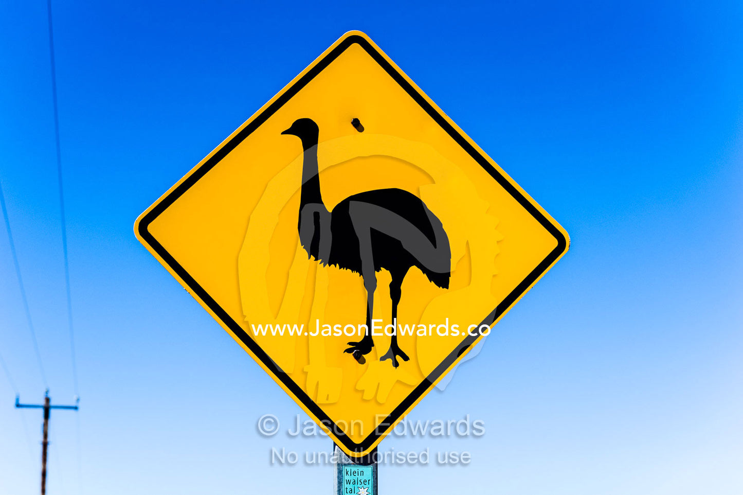 An Emu wildlife warning sign near a remote town in the desert. Exmouth, Ningaloo Reef, Western Australia, Australia.