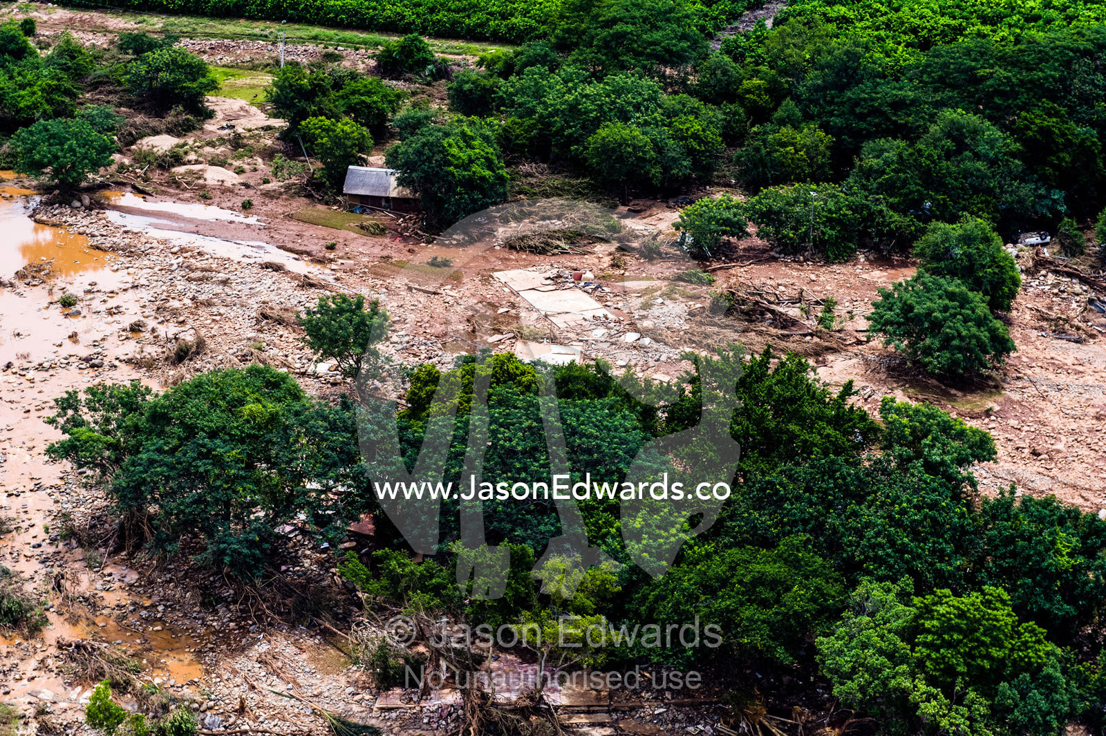 A village on a savannah plain destroyed by raging flood waters. Kruger National Park, South Africa.