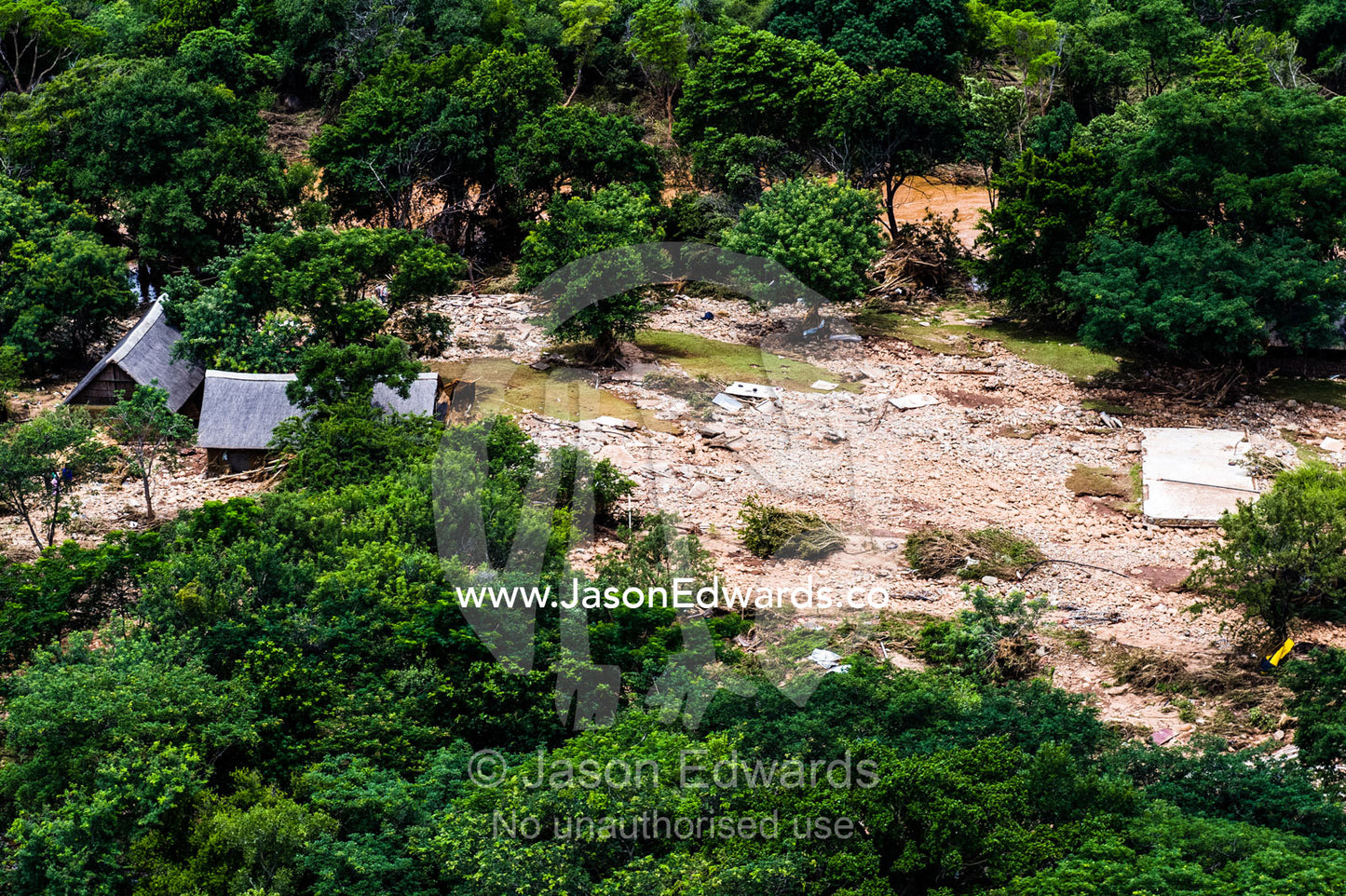 A village on a savannah plain destroyed by raging flood waters. Kruger National Park, South Africa.