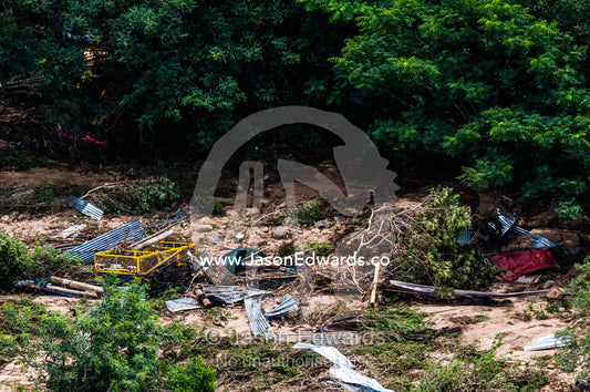Debris from a savannah village destroyed by raging flood waters. Kruger National Park, South Africa.
