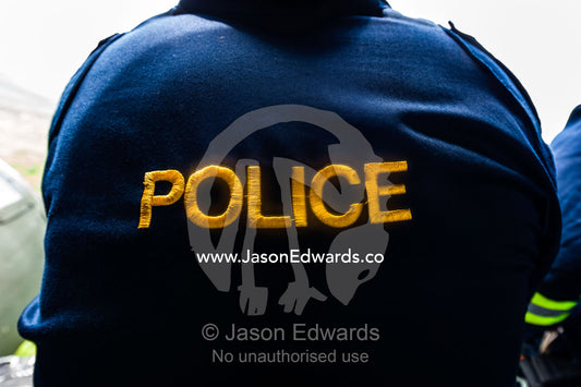 A police rescue officer jacket on duty in an airforce helicopter. Kruger National Park, South Africa.