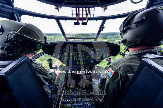 The pilot flight crew of an Atlas Oryx airforce helicopter on patrol. Kruger National Park, South Africa.