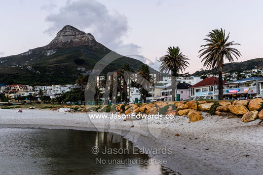 Restaurants line the foreshore of a small coastal town. Bantry Bay, Cape Town, Western Cape, South Africa.