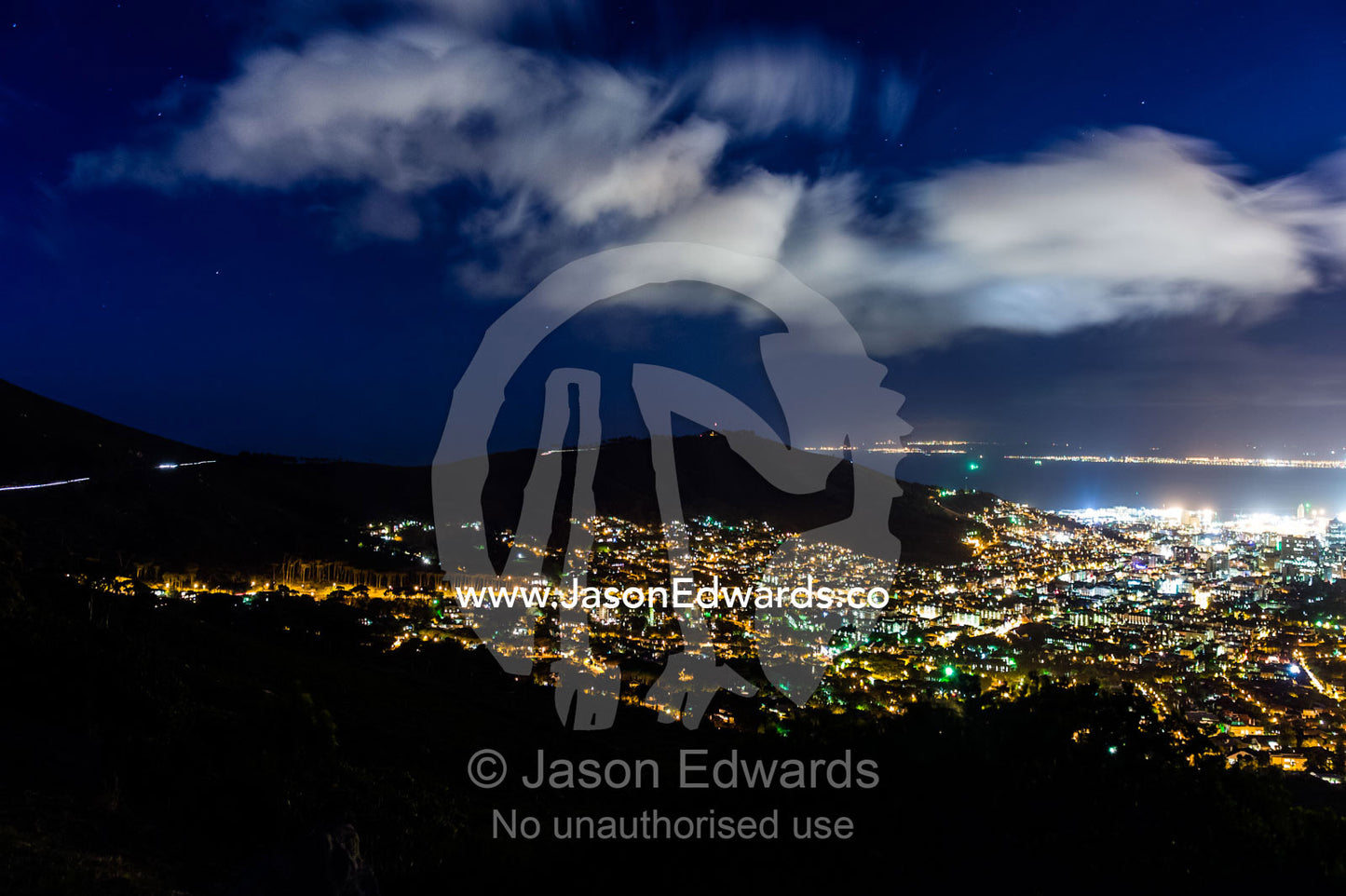 Cape Town's sprawling suburbs, harbor and shopping district at night. Table Mountain, Cape Town, Cape Peninsula, Western Cape, South Africa.