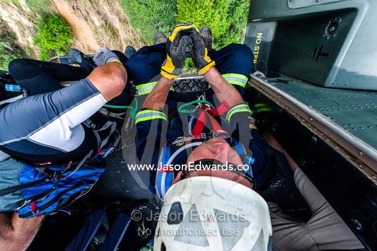 Police and Airforce rescue crews search for trapped flood survivors. The Lowveld Area, Olifants River, Kruger National Park, South Africa.