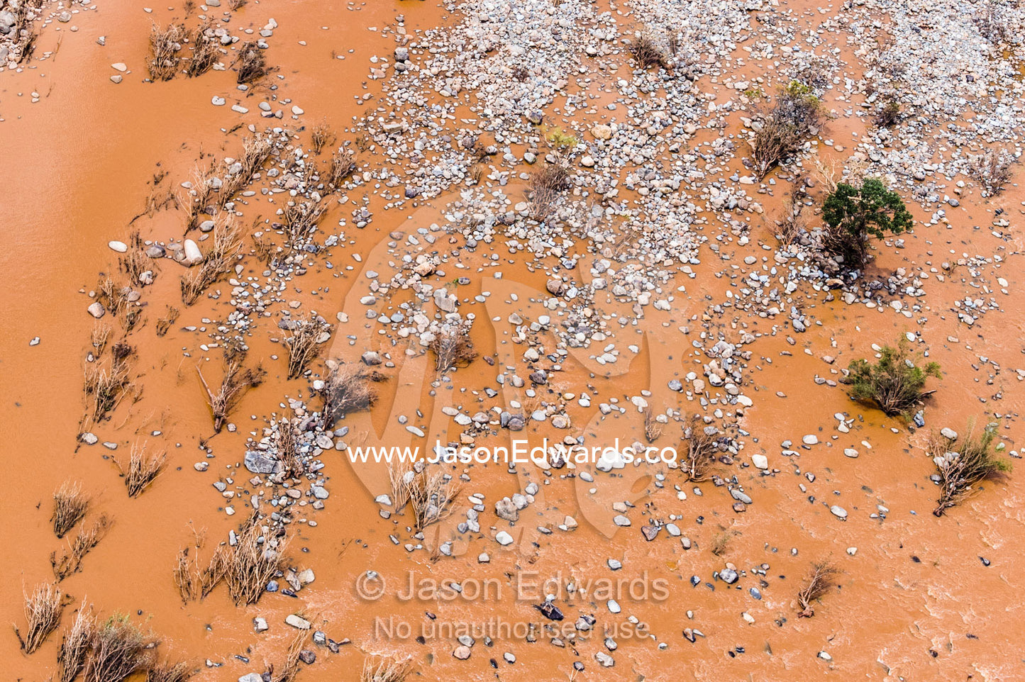 Boulders and rubble strewn across a plain by flood waters. Kruger National Park, South Africa.