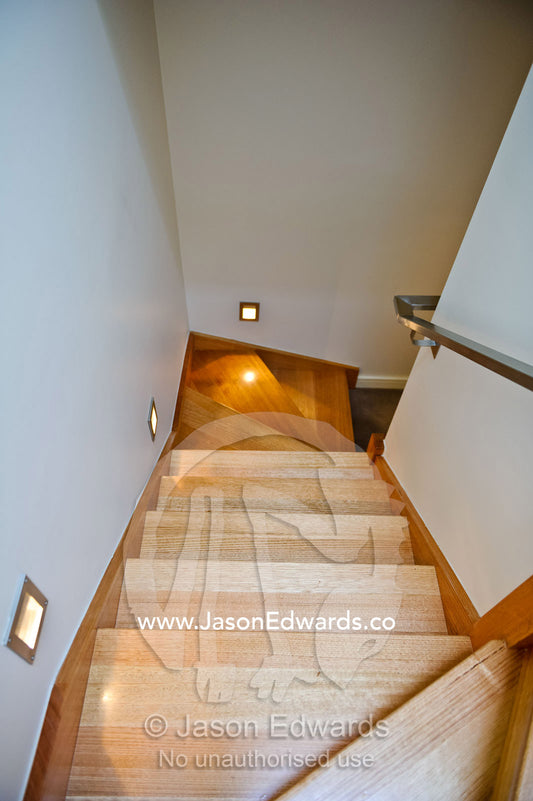 Looking down a stairwell in an inner city warehouse apartment. North Melbourne, Melbourne, Victoria, Australia.