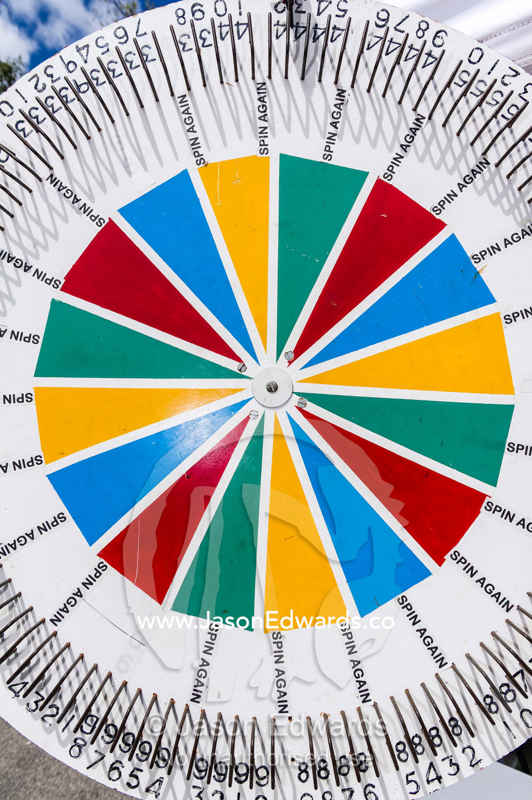 A colourful spinning wheel awards prizes at a school fete fundraiser. Lee Street Primary School, Carlton North, Melbourne, Victoria, Australia.