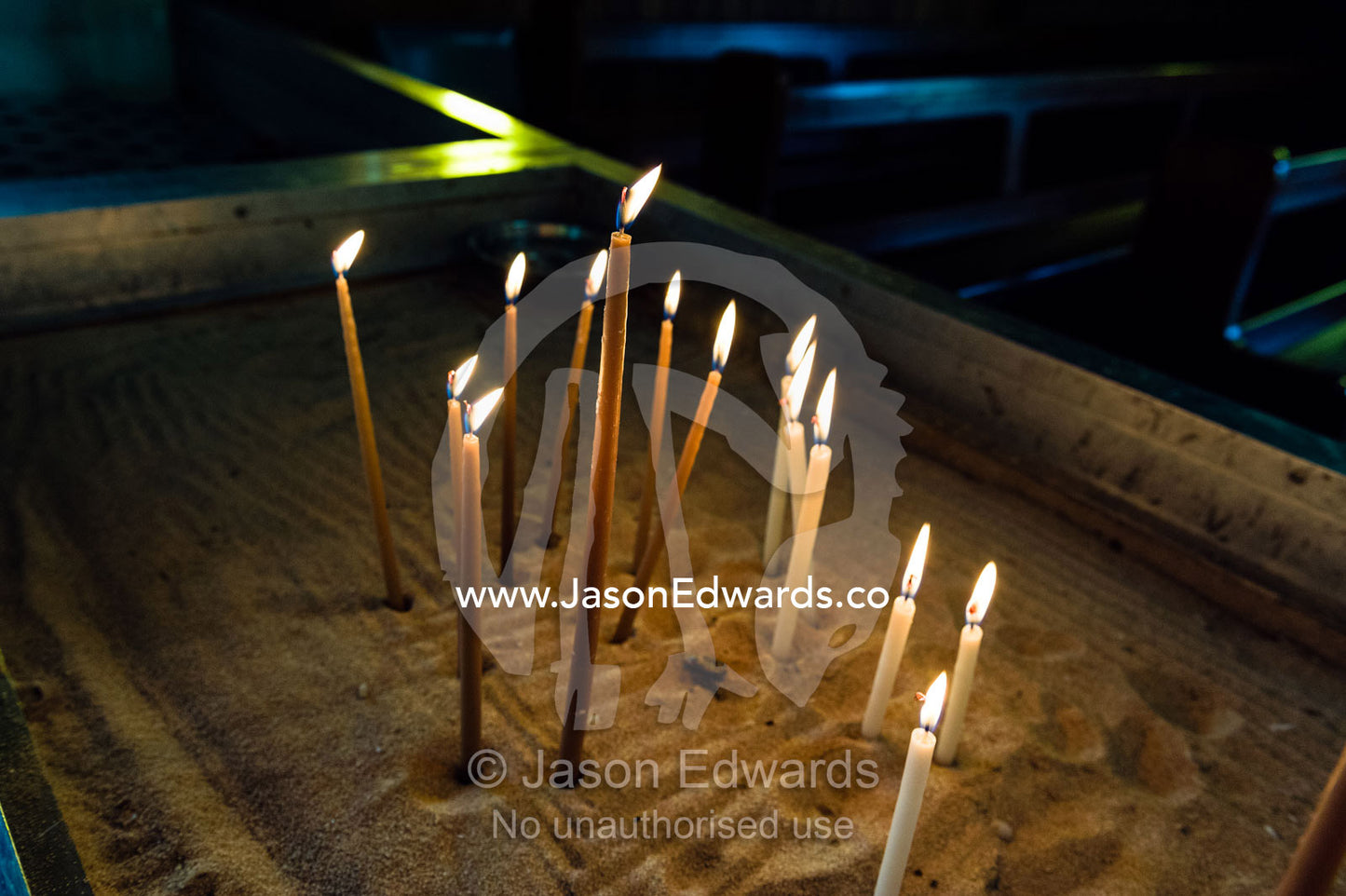 Prayer candles await worshippers in a quiet Greek Orthodox church. St Andrews Greek Orthodox Church, Melbourne, Victoria, Australia.