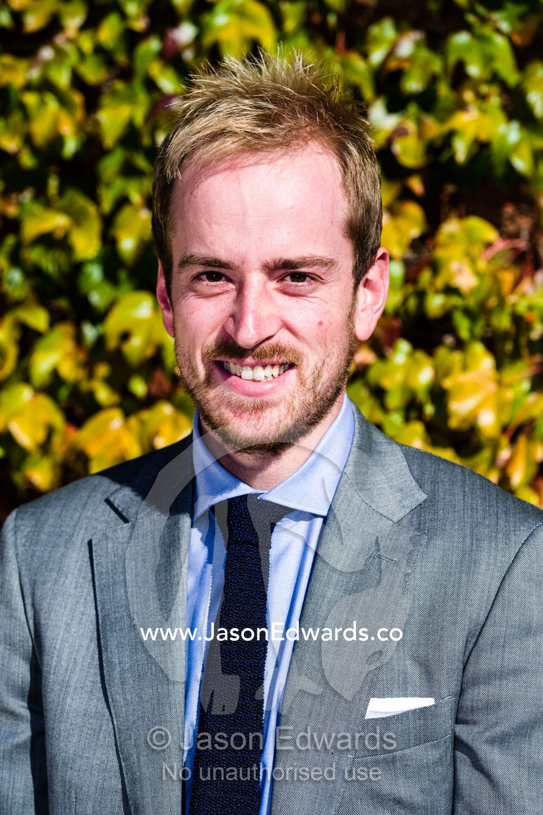 A well-dressed real estate agent in a business suit. Collingwood, Melbourne, Victoria, Australia.
