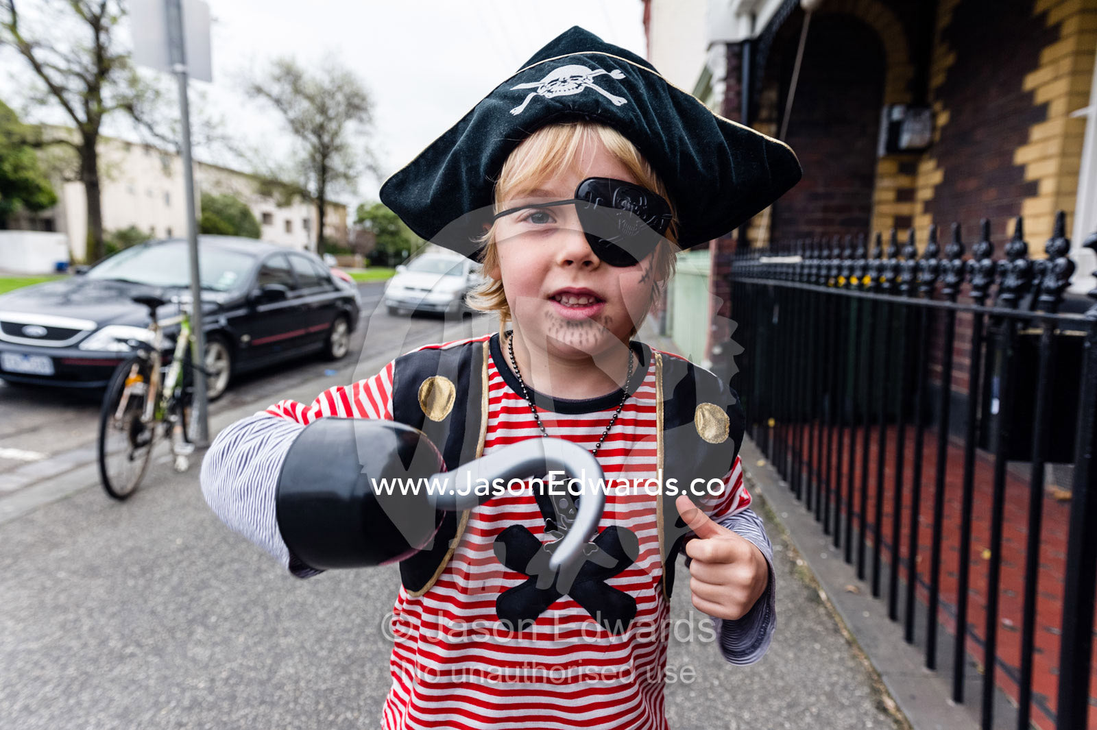 A young boy dresses as a wicked pirate giving a snarl. Carlton North, Melbourne, Victoria, Australia.