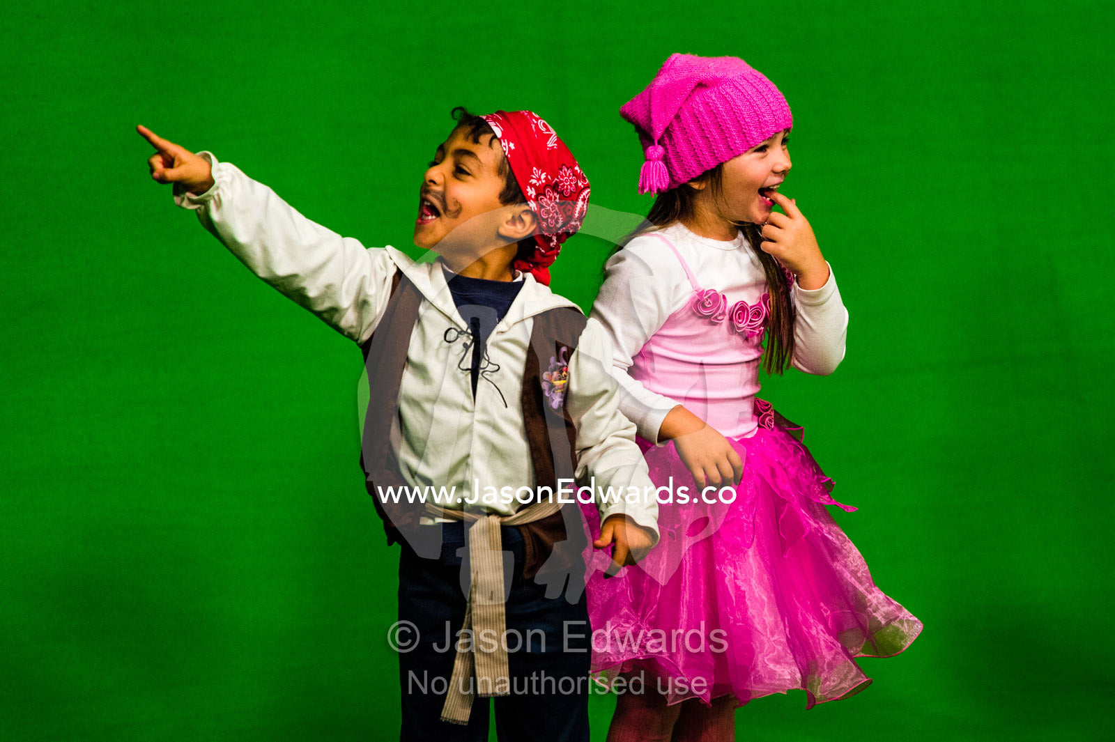 School children performing in front of a green screen at a studio. Victoria, Melbourne, Australia.