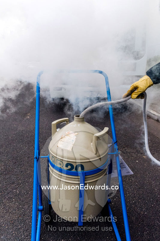 Liquid nitrogen is loaded into a vacuum flask for transportation. Melbourne, Victoria, Australia.