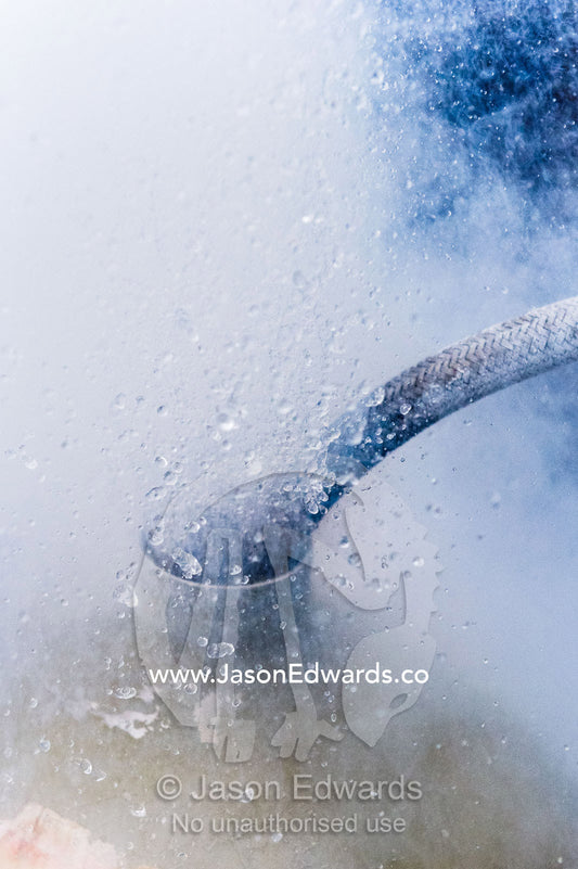 Bubbles, steam and liquid nitrogen explode from a vacuum flask. Melbourne, Victoria, Australia.