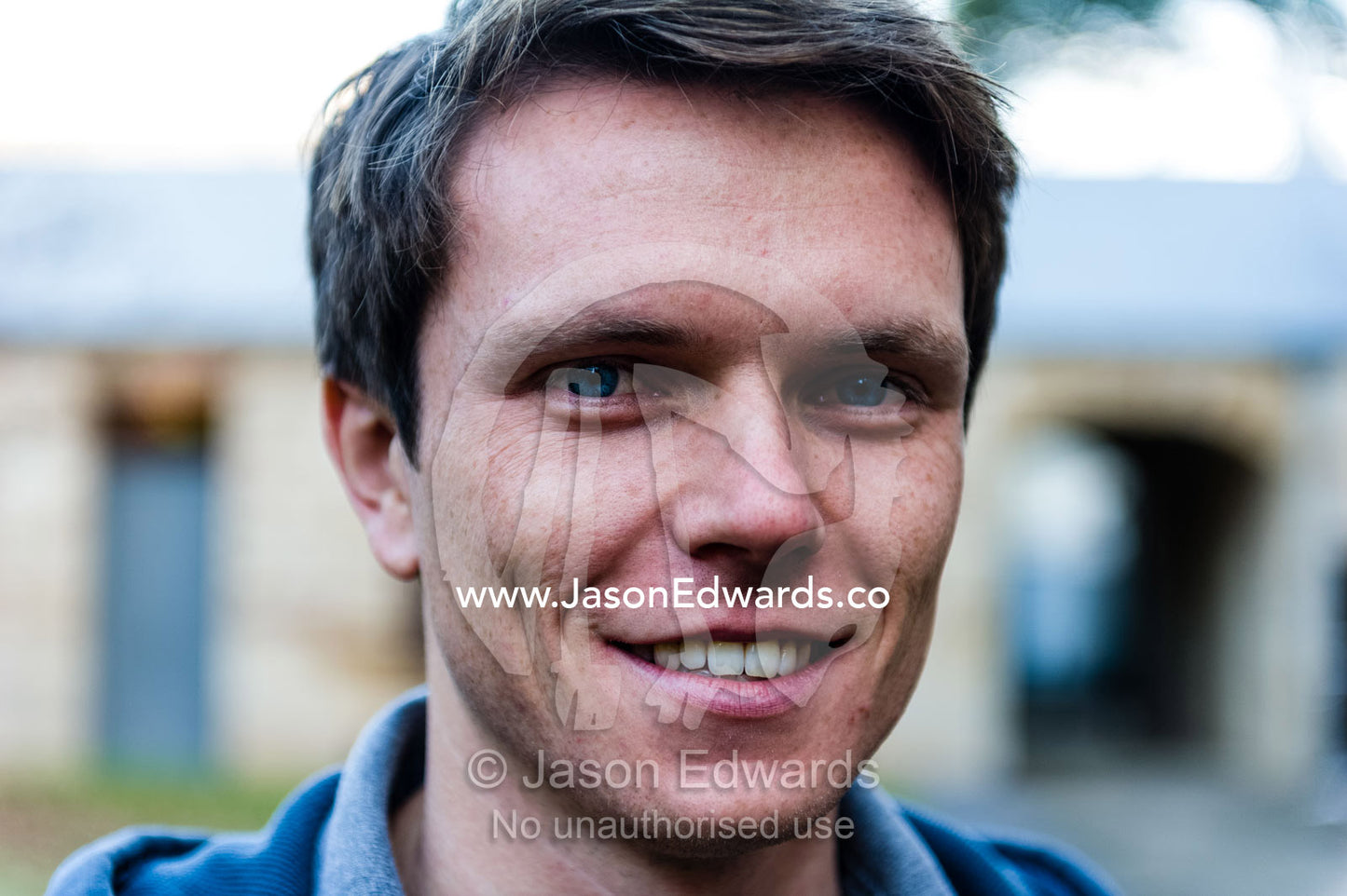 A clean-cut, healthy and handsome man smiling. The Sydney Mint, Sydney, New South Wales, Australia.